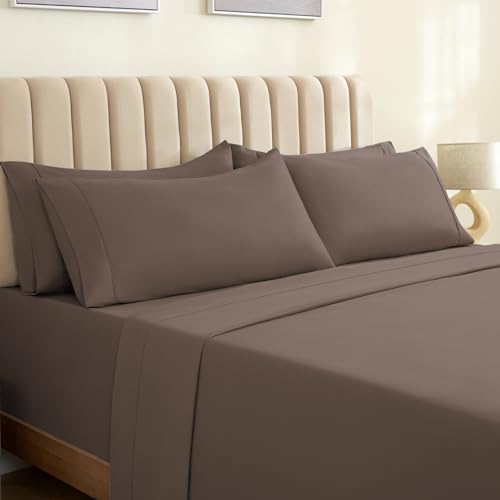 a bed with brown sheets