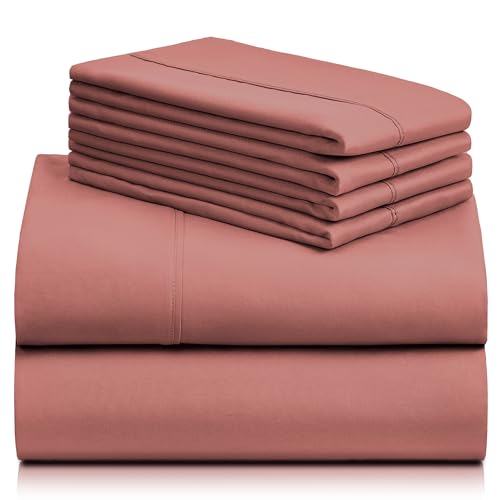 a stack of pink sheets