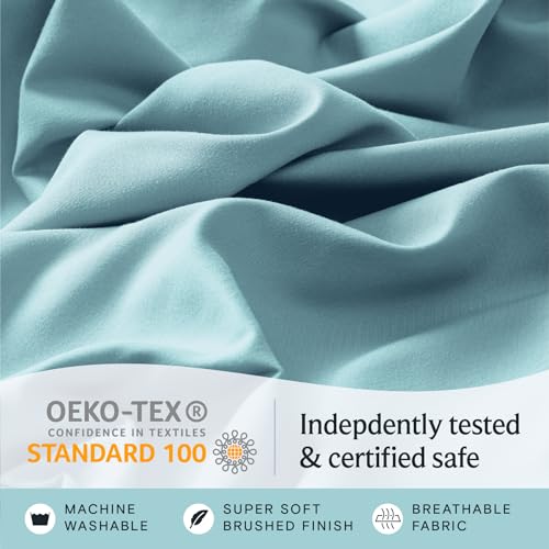 a close up of a fabric with text: 'OEKO-TEX Indepdently tested CONFIDENCE IN TEXTILES STANDARD 100 & certified safe MACHINE SUPER SOFT BREATHABLE WASHABLE BRUSHED FINISH FABRIC'