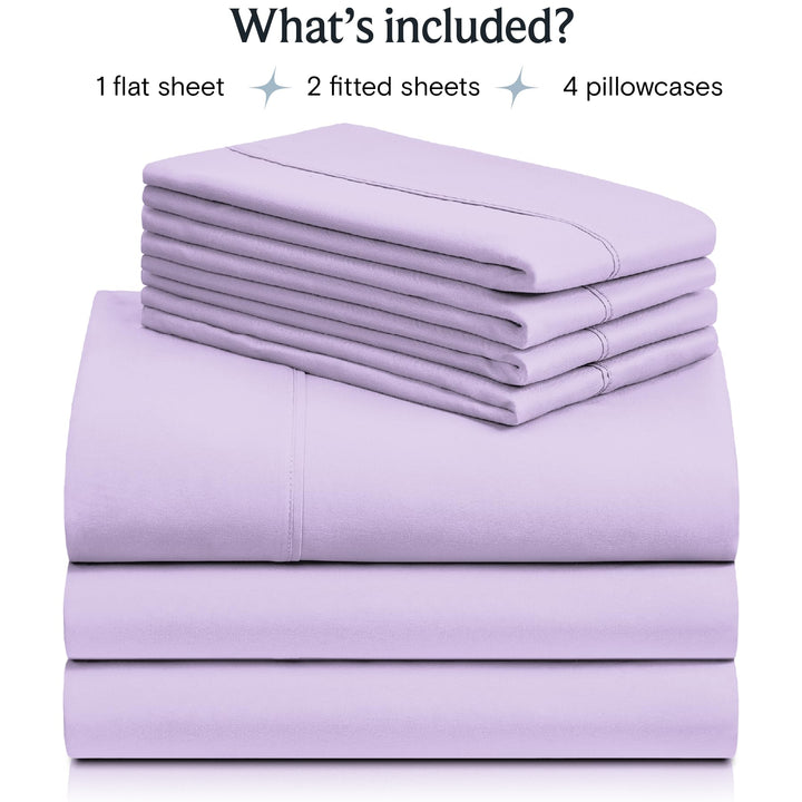 a stack of purple sheets with text: 'What's included? 1 flat sheet 2 fitted sheets 4 pillowcases'