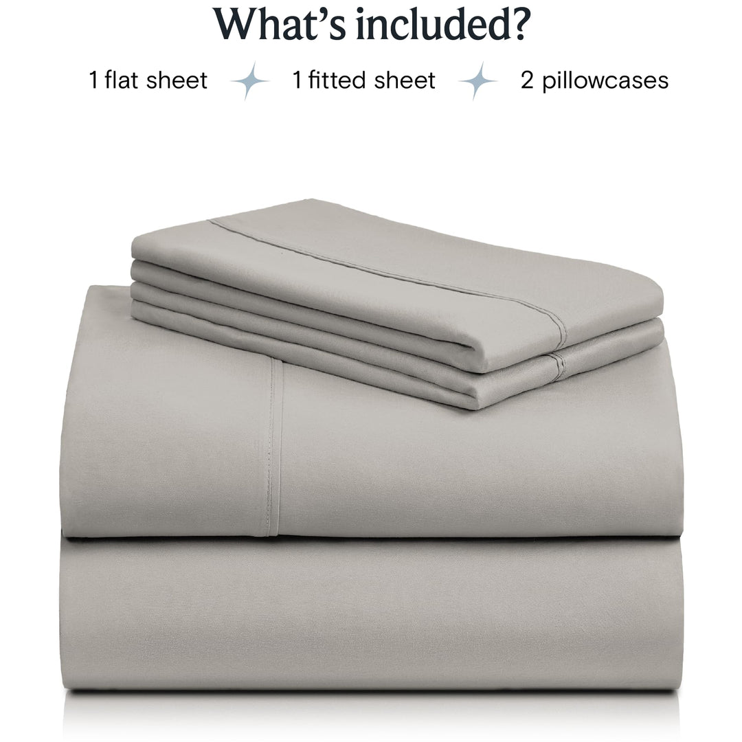 a stack of grey sheets with text: 'What's included? 1 flat sheet 1 fitted sheet 2 pillowcases'