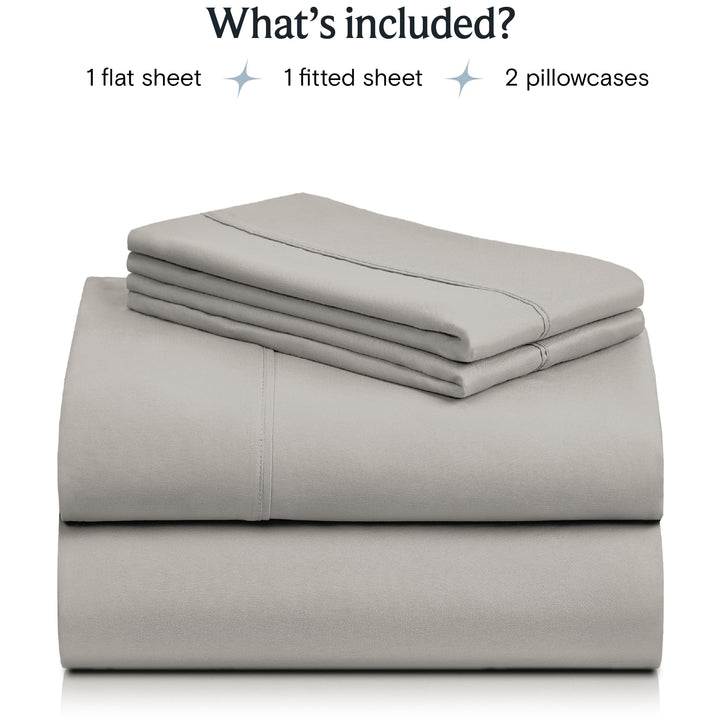 a stack of grey sheets with text: 'What's included? 1 flat sheet 1 fitted sheet 2 pillowcases'