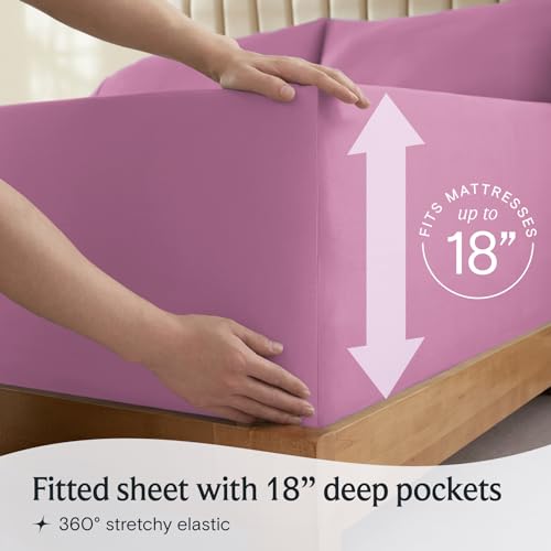 a person holding a mattress with text: 'MATTRESSES up to 18' Fitted sheet with 18" deep pockets 360º stretchy elastic'
