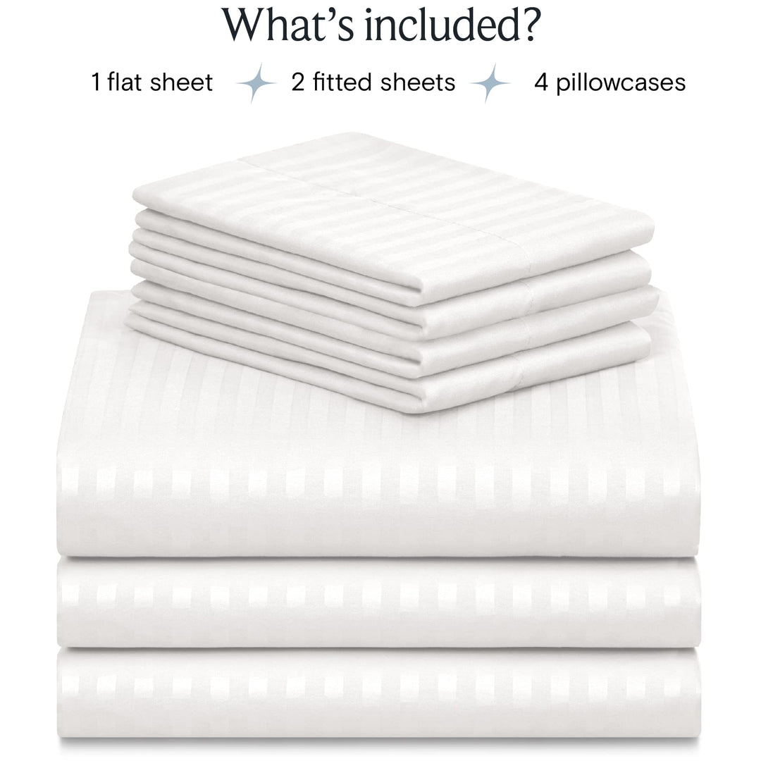 a stack of white sheets with text: 'What's included? 1 flat sheet 2 fitted sheets 4 pillowcases'