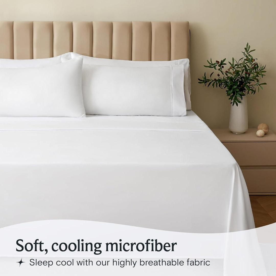 a bed with white sheets and a vase of flowers with text: 'Soft, cooling microfiber Sleep cool with our highly breathable fabric'