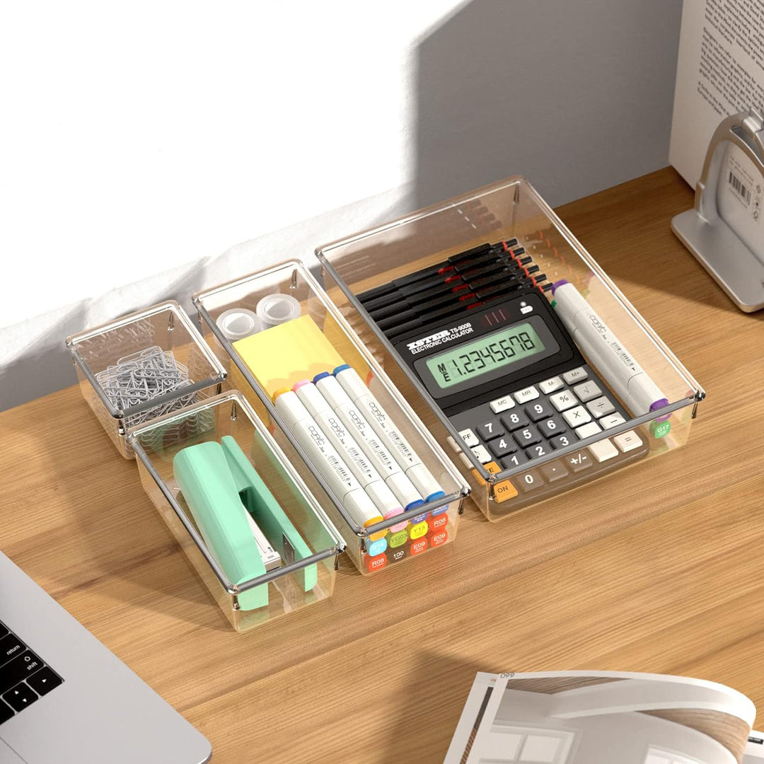 a calculator and office supplies on a desk with text: '------ -- ELECTRONIC CALCULATO !!!!! 8 % 5 G17 GO 100 E09'
