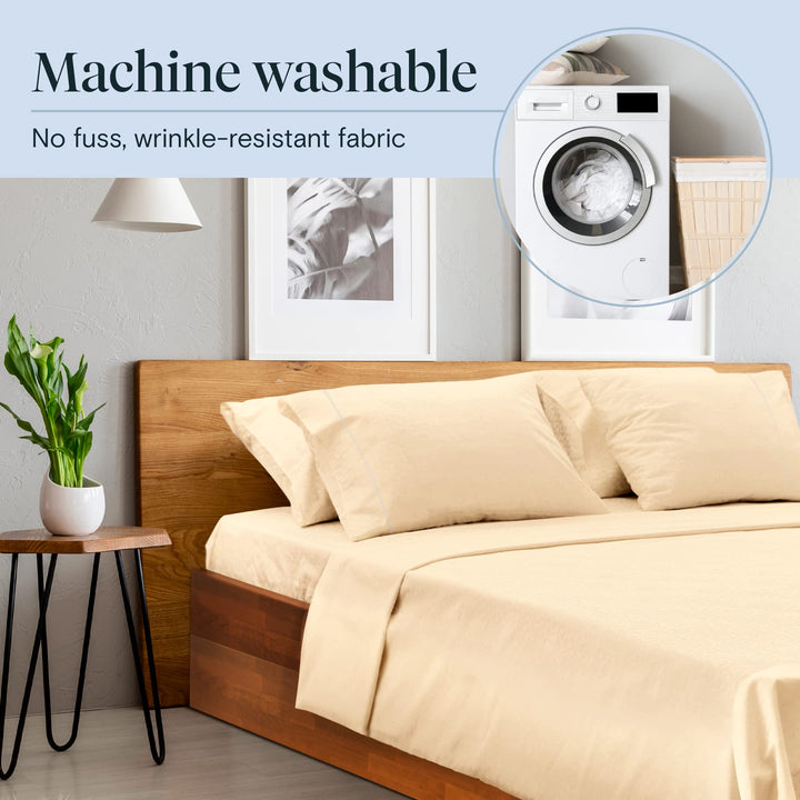 a bed with a wood headboard and a plant in a pot with text: 'Machine washable No fuss, wrinkle-resistant fabric'