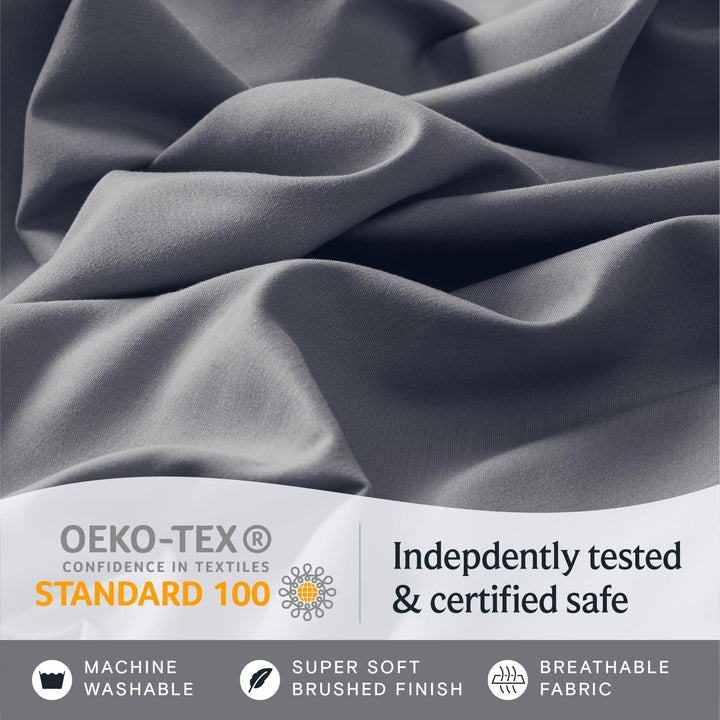 a close up of a fabric with text: 'OEKO-TEX Indepdently tested CONFIDENCE IN TEXTILES STANDARD 100 & certified safe MACHINE SUPER SOFT BREATHABLE WASHABLE BRUSHED FINISH FABRIC'