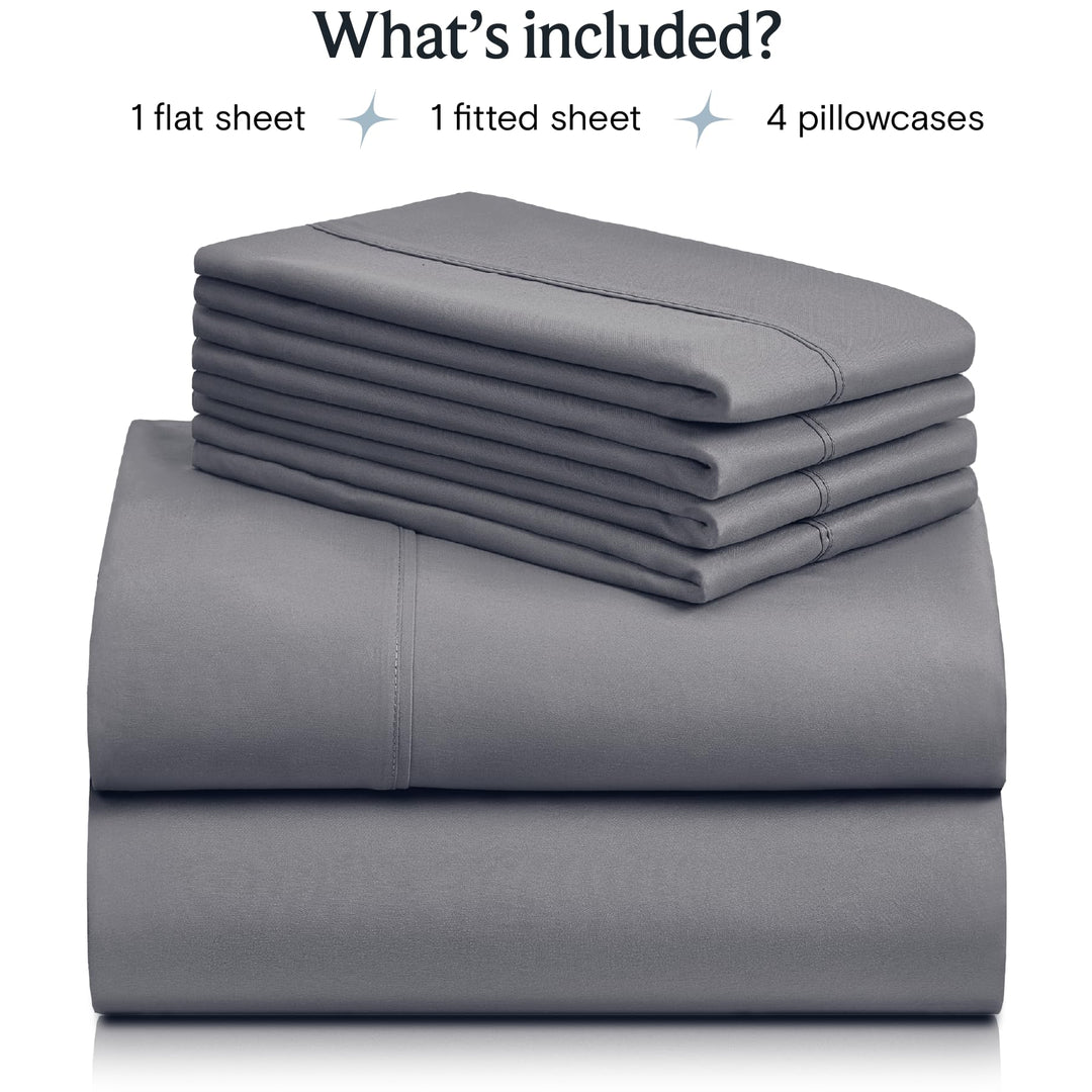 a stack of grey sheets with text: 'What's included? 1 flat sheet 1 fitted sheet 4 pillowcases'