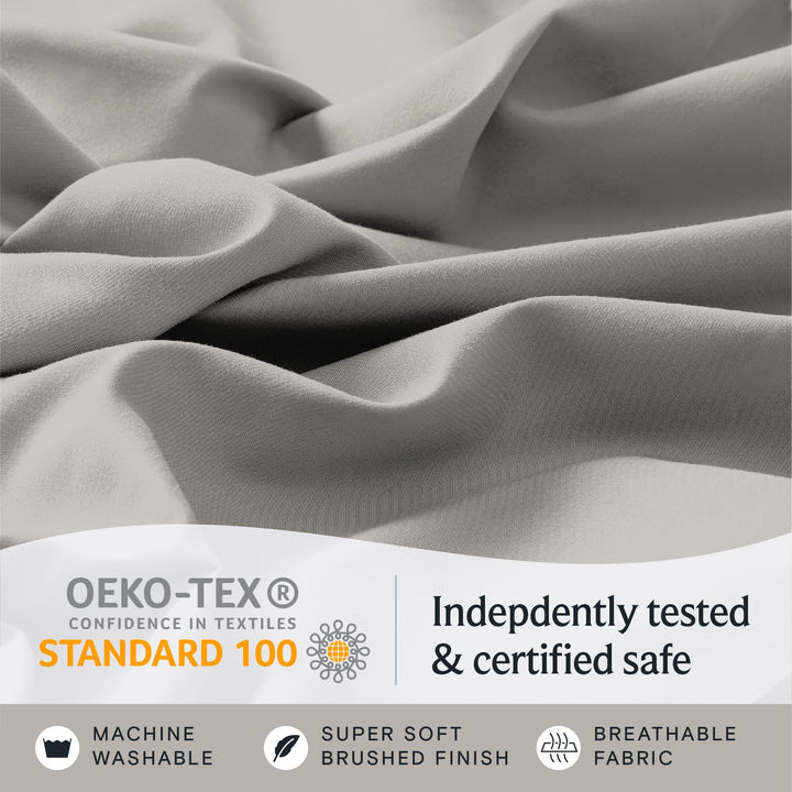 a close up of a fabric with text: 'OEKO-TEX Indepdently tested CONFIDENCE IN TEXTILES STANDARD 100 & certified safe MACHINE SUPER SOFT BREATHABLE WASHABLE BRUSHED FINISH FABRIC'