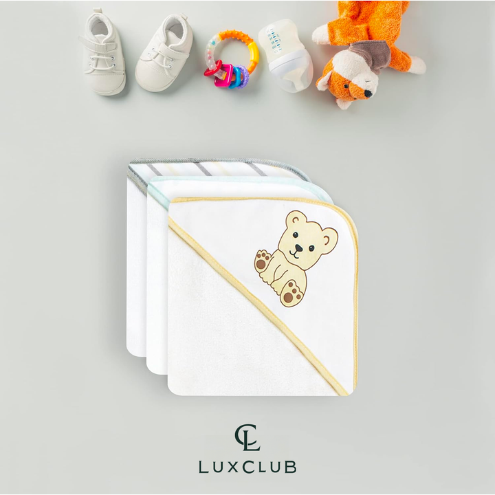 a group of baby clothes and toys with text: 'LUXCLUB'