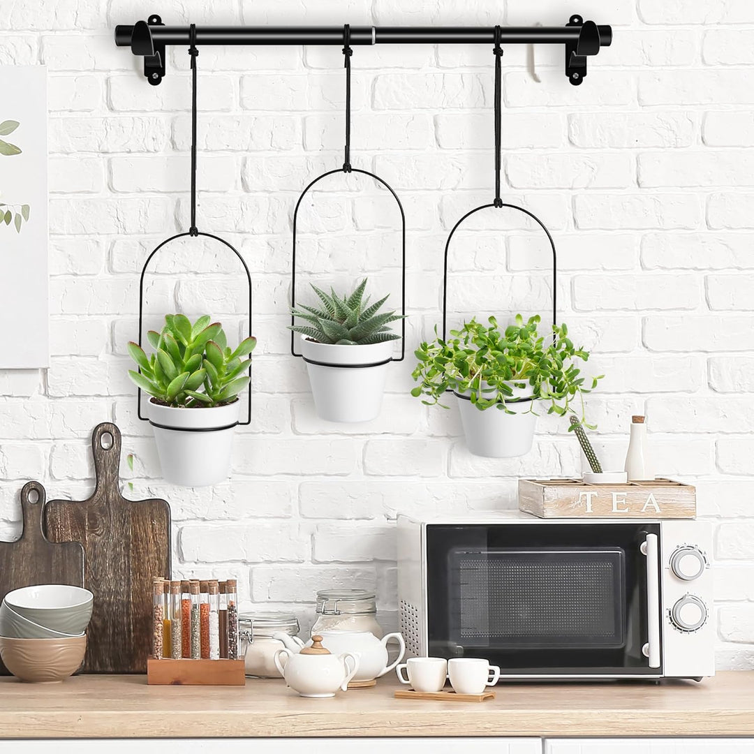 a kitchen counter with pots and plants on it with text: 'TEA'