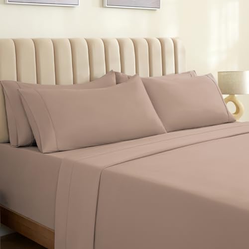 a bed with a beige bedding
