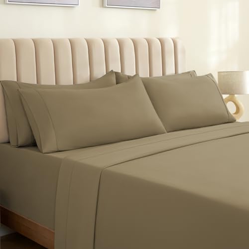 a bed with a beige headboard