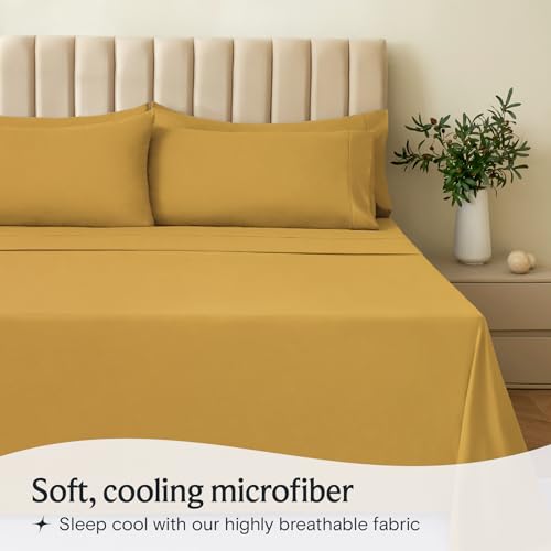 a bed with a yellow sheet and pillows with text: 'Soft, cooling microfiber Sleep cool with our highly breathable fabric'