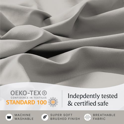 a close up of a fabric with text: 'OEKO-TEX Indepdently tested CONFIDENCE IN TEXTILES STANDARD 100 & certified safe MACHINE SUPER SOFT BREATHABLE WASHABLE BRUSHED FINISH FABRIC'