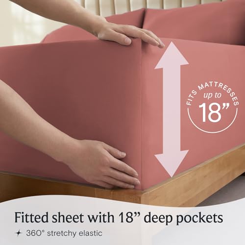a person holding a mattress with text: 'RESSES FITS 18' Fitted sheet with 18" deep pockets 360º stretchy elastic'