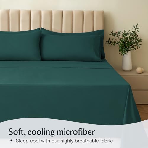 a bed with green sheets and pillows with text: 'Soft, cooling microfiber Sleep cool with our highly breathable fabric'