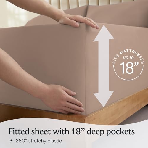 a person holding a box with a mattress with text: 'RESSES FITS Fitted sheet with 18" deep pockets 360º stretchy elastic'