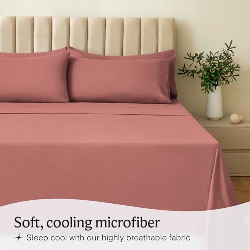 a bed with pink sheets and pillows with text: 'Soft, cooling microfiber Sleep cool with our highly breathable fabric'
