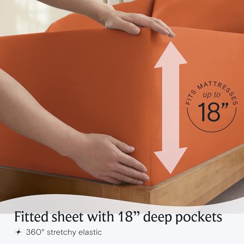 a person holding an orange couch with text: 'RESSES FITS MA 18 Fitted sheet with 18" deep pockets 360º stretchy elastic'
