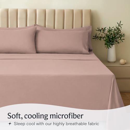 a bed with pink sheets and pillows with text: 'Soft, cooling microfiber Sleep cool with our highly breathable fabric'