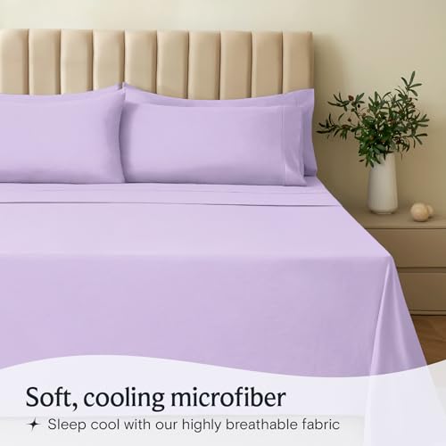 a bed with purple sheets and pillows with text: 'Soft, cooling microfiber Sleep cool with our highly breathable fabric'