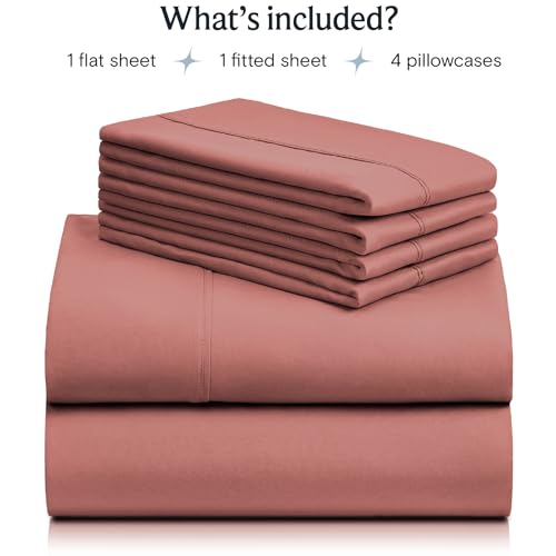 a stack of pink sheets with text: 'What's included? 1 flat sheet 1 fitted sheet 4 pillowcases'