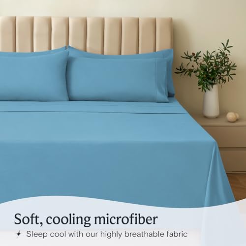 a bed with blue sheets and a plant in a vase with text: 'Soft, cooling microfiber Sleep cool with our highly breathable fabric'