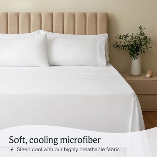 a bed with white sheets and a plant in a vase with text: 'Soft, cooling microfiber Sleep cool with our highly breathable fabric'