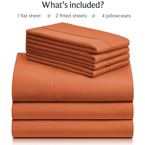 a stack of orange sheets with text: 'What's included? 1 flat sheet 2 fitted sheets 4 pillowcases'