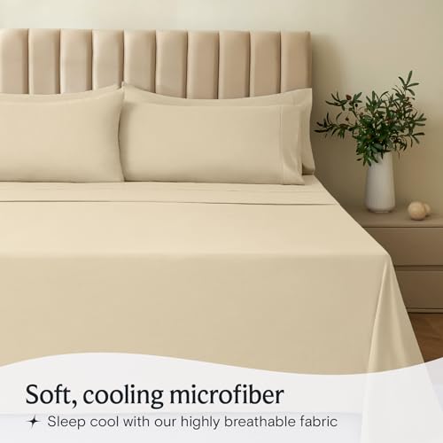 a bed with a plant in a vase with text: 'Soft, cooling microfiber Sleep cool with our highly breathable fabric'