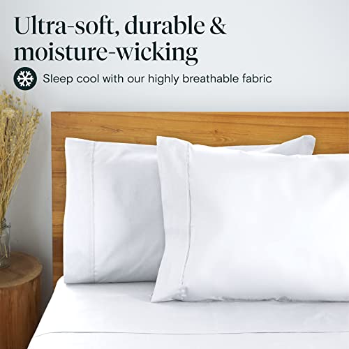 a bed with white sheets and a wood headboard with text: 'Ultra-soft, durable & moisture-wicking Sleep cool with our highly breathable fabric'