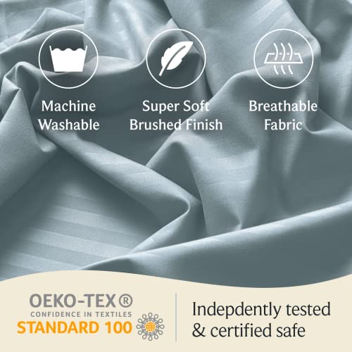 a close-up of a fabric with text: 'Machine Super Soft Breathable Washable Brushed Finish Fabric OEKO-TEX Indepdently tested CONFIDENCE IN TEXTILES STANDARD 100 & certified safe'