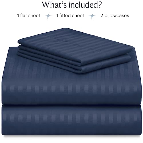 a stack of blue sheets with text: 'What's included? 1 flat sheet 1 fitted sheet 2 pillowcases'