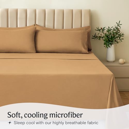 a bed with a plant in a vase with text: 'Soft, cooling microfiber Sleep cool with our highly breathable fabric'