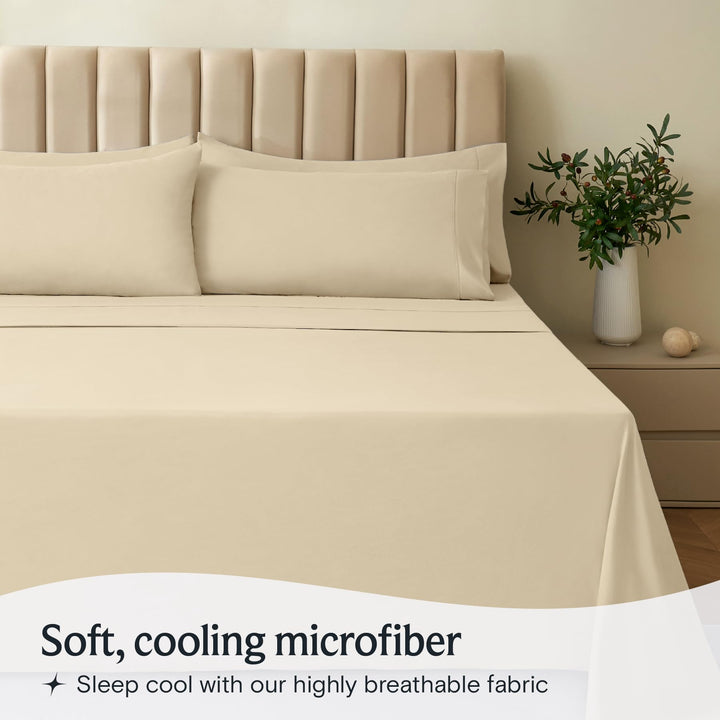 a bed with a plant in a vase with text: 'Soft, cooling microfiber Sleep cool with our highly breathable fabric'