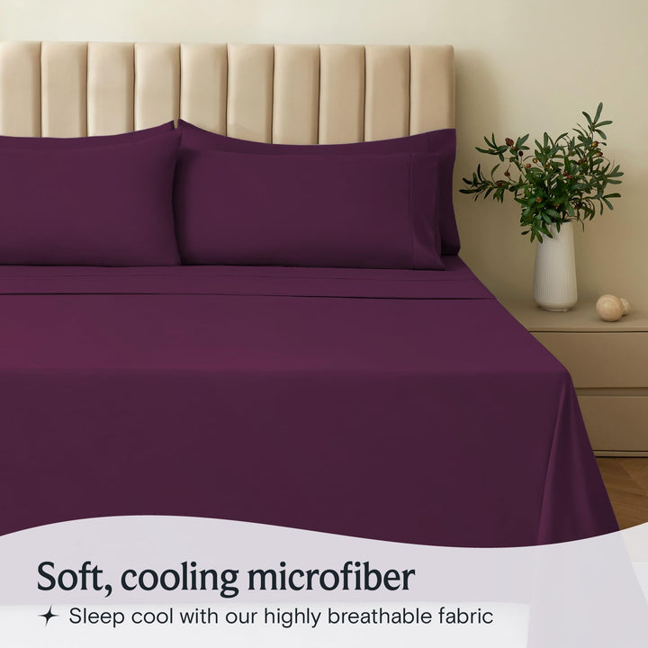 a purple bed with pillows and a vase of flowers with text: 'Soft, cooling microfiber Sleep cool with our highly breathable fabric'