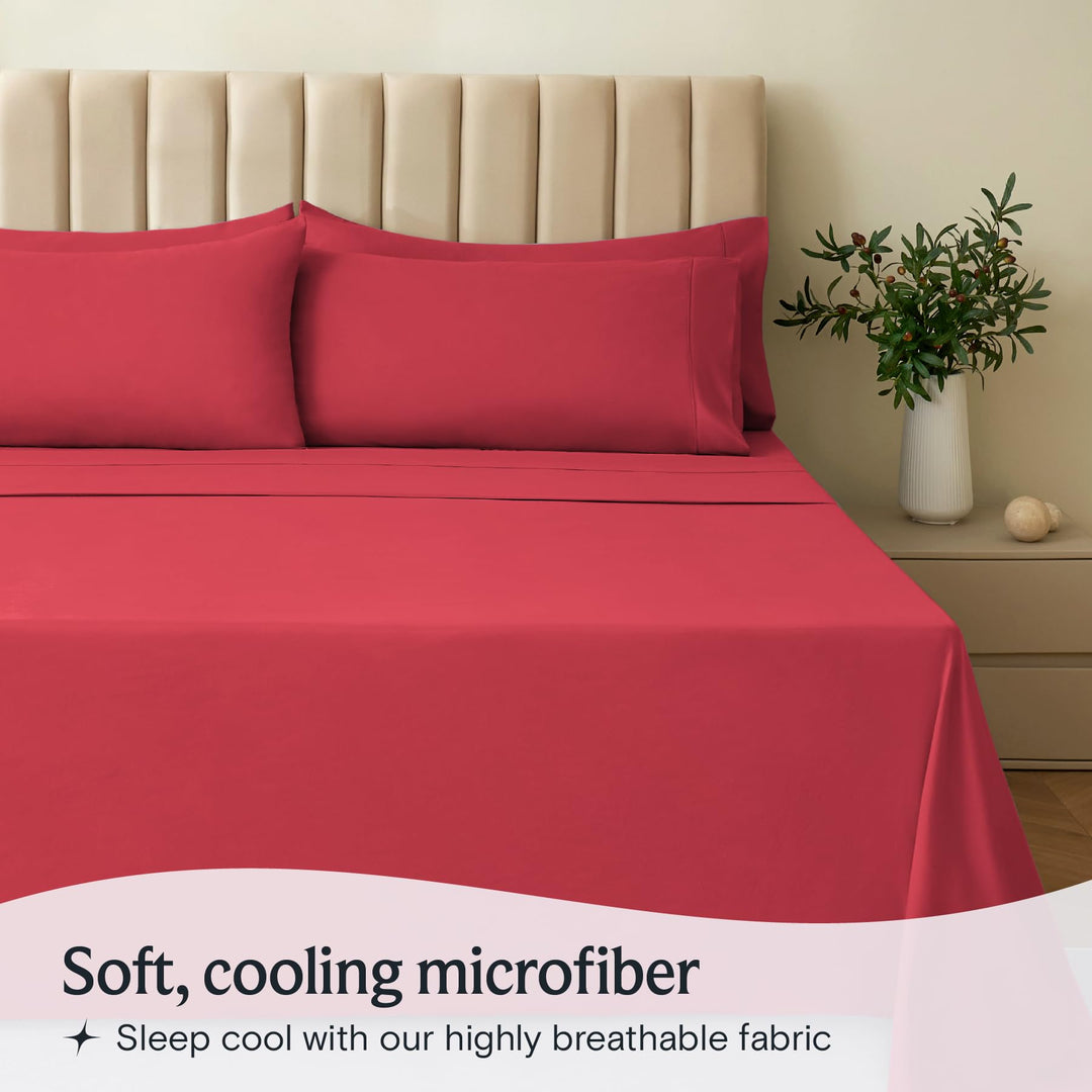 a bed with red sheets and pillows with text: 'Soft, cooling microfiber Sleep cool with our highly breathable fabric'