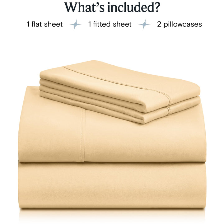a stack of beige sheets with text: 'What's included? 1 flat sheet 1 fitted sheet 2 pillowcases'