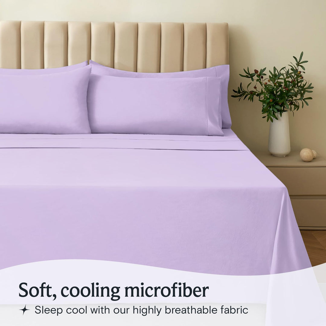 a bed with purple sheets and pillows with text: 'Soft, cooling microfiber Sleep cool with our highly breathable fabric'