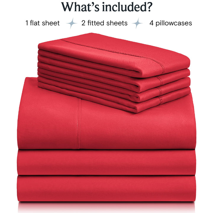 a stack of red sheets with text: 'What's included? 1 flat sheet 2 fitted sheets 4 pillowcases'
