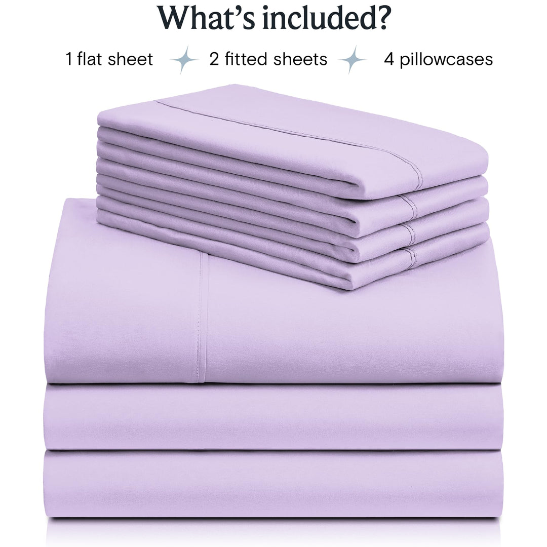 a stack of purple sheets with text: 'What's included? 1 flat sheet 2 fitted sheets 4 pillowcases'