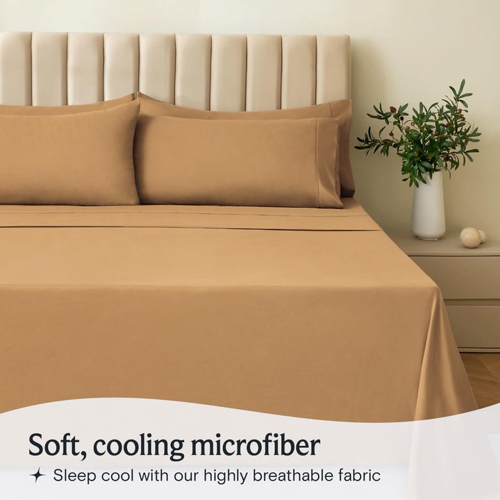 a bed with a plant in a vase with text: 'Soft, cooling microfiber Sleep cool with our highly breathable fabric'
