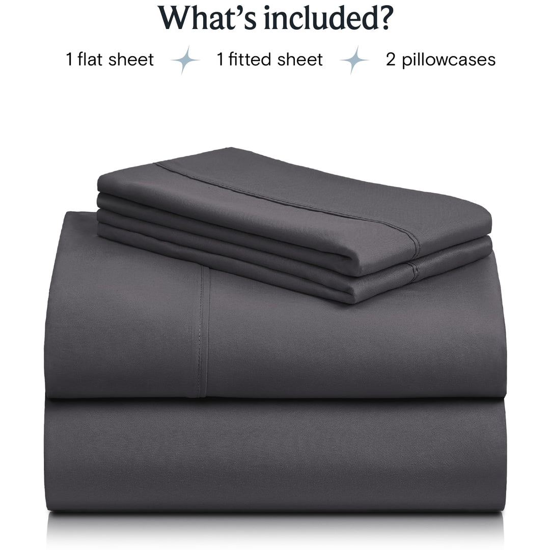 a stack of grey sheets with text: 'What's included? 1 flat sheet 1 fitted sheet 2 pillowcases'