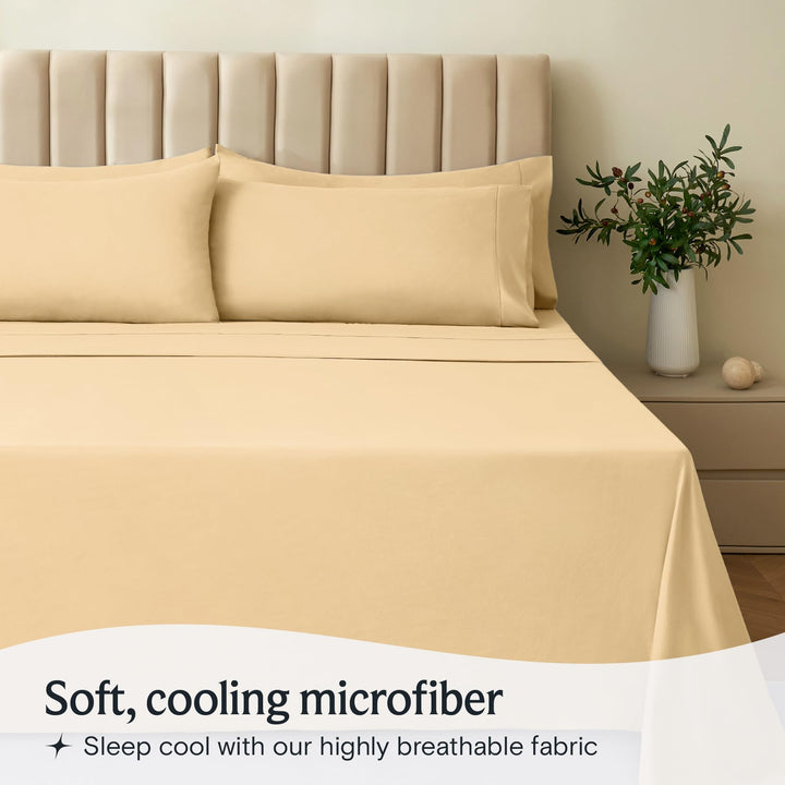 a bed with a plant in a vase with text: 'Soft, cooling microfiber Sleep cool with our highly breathable fabric'