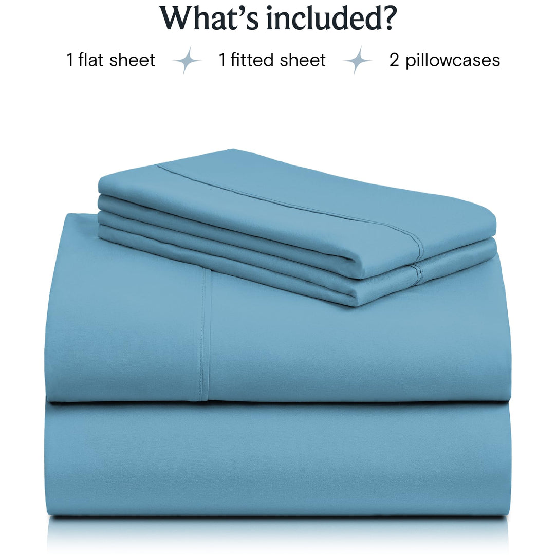 a stack of blue sheets with text: 'What's included? 1 flat sheet 1 fitted sheet 2 pillowcases'