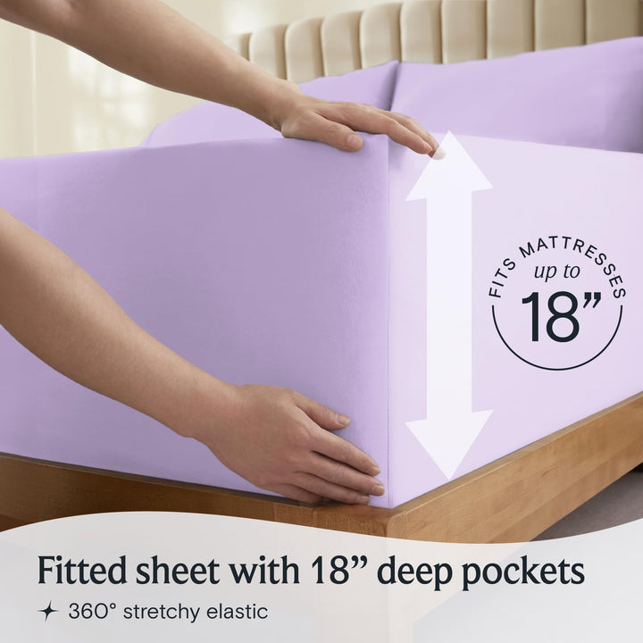 a person holding a purple sheet with white arrows with text: 'MATTRESSES up to ITS 18' Fitted sheet with 18" deep pockets 360º stretchy elastic'