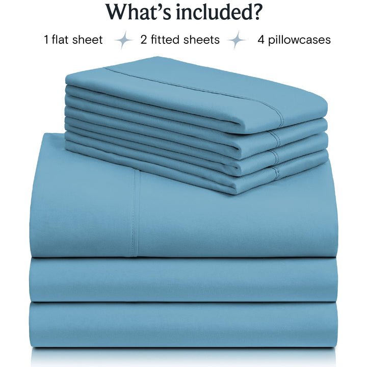a stack of blue sheets with text: 'What's included? 1 flat sheet 2 fitted sheets 4 pillowcases'