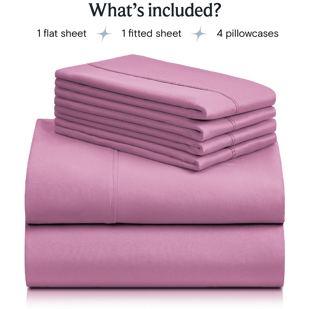 a stack of pink sheets with text: 'What's included? 1 flat sheet 1 fitted sheet 4 pillowcases'